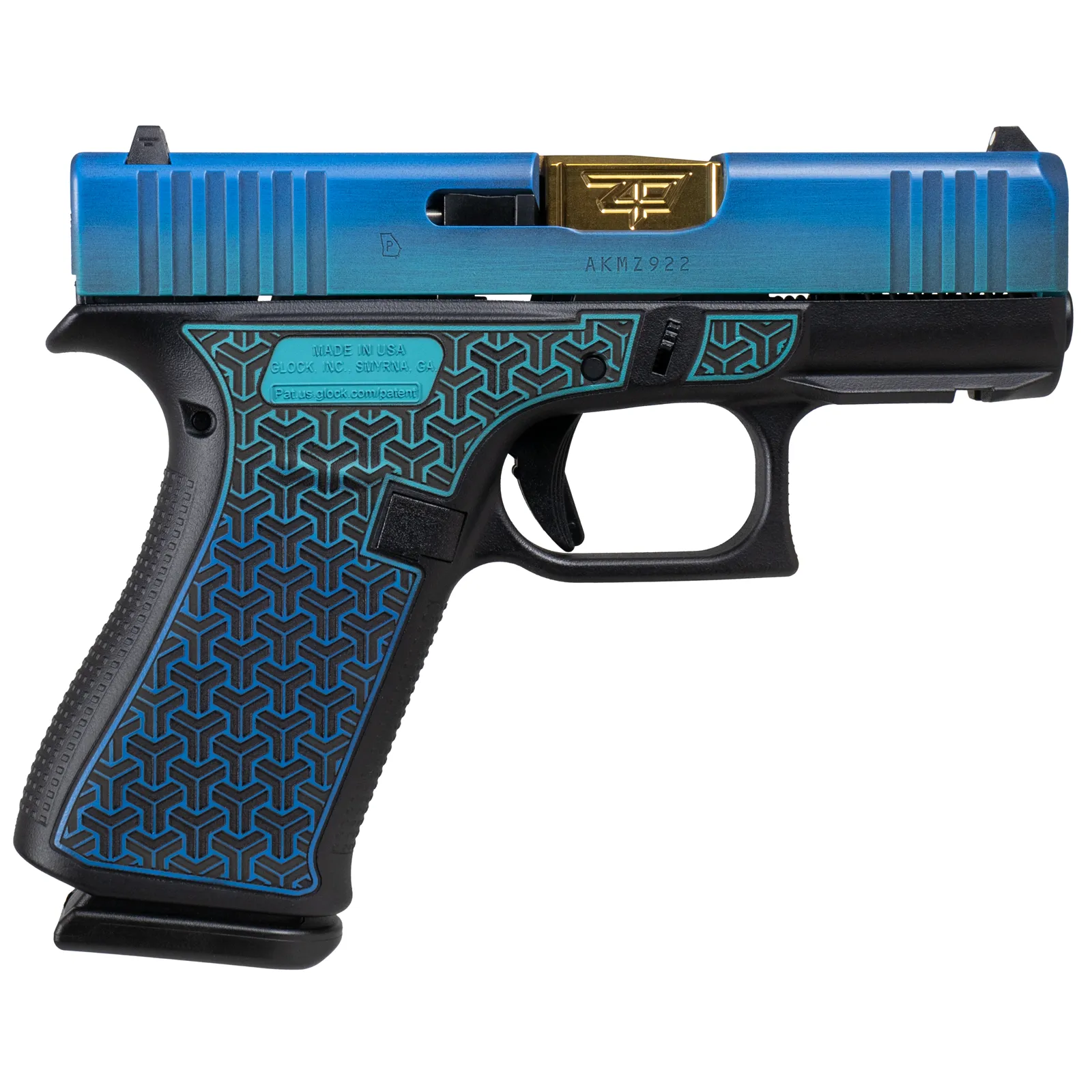 A blue fade slide over a black frame carrying an engraved hexagonal pattern filled in teal, with a gold slide plate. Geometric where the LadyBug is floral.