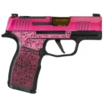 The same LadyBug scrollwork and pink slide as the standard build, with a gold-finished ported barrel standing proud of the slide instead of a flush one.