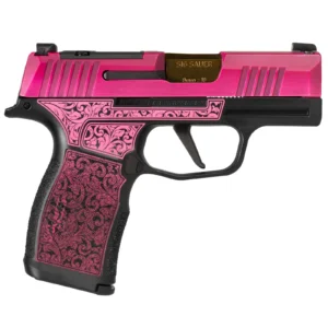 The same LadyBug scrollwork and pink slide as the standard build, with a gold-finished ported barrel standing proud of the slide instead of a flush one.