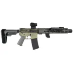 A short 300 Blackout AR pistol built around a suppressor rather than with one added afterwards, finished in OD green and tungsten with the optic and light fitted.